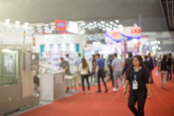 Blurred business people at a trade fair