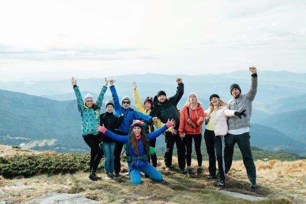 fun group of friends traveling in the mountains.